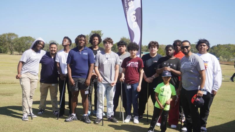 Scholars pictured on a golf course