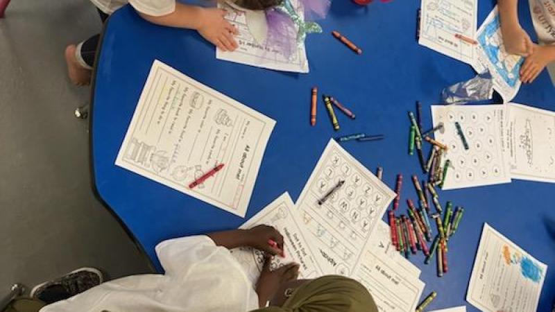 Young children coloring at the table