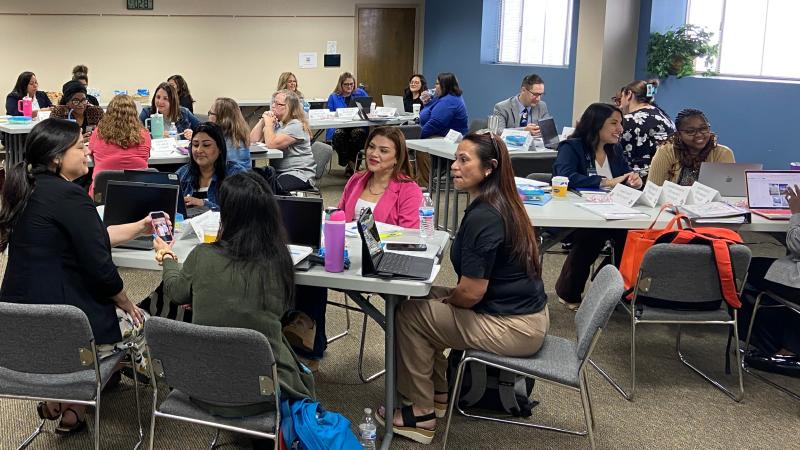 Educators working together to plan.